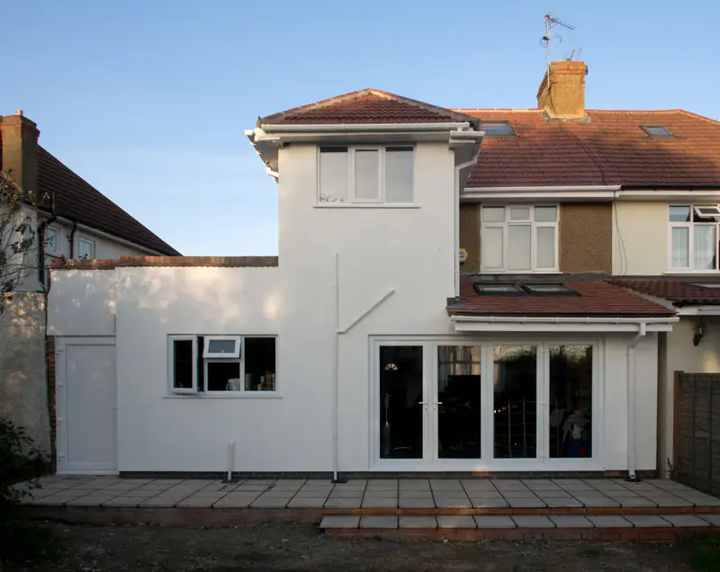 Windows and doors in Fenham White rendered family house with glazed doors at the side, illustrating windows and doors for homes in Fenham