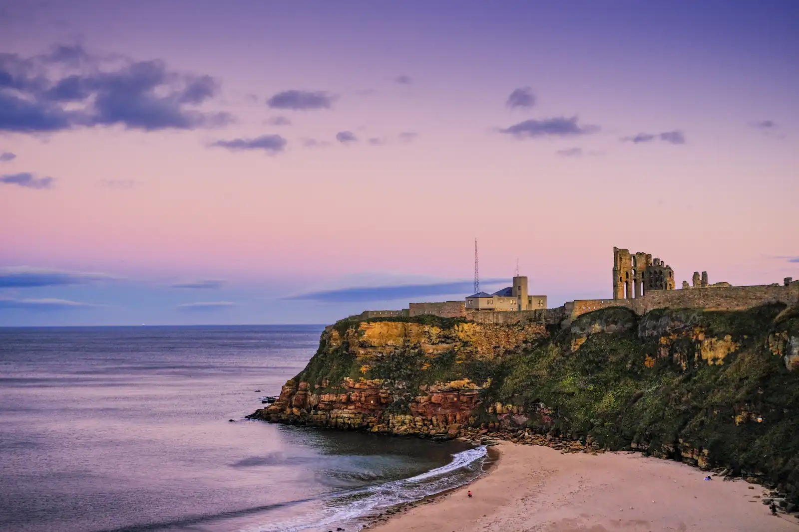 Windows and doors in Tynemouth Tynemouth headland and priory ruins above the beach at dusk